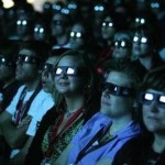 Visitors wear 3D glasses as they watch a preview of the upcoming movie "Avatar" during the 40th annual Comic Con Convention in San Diego